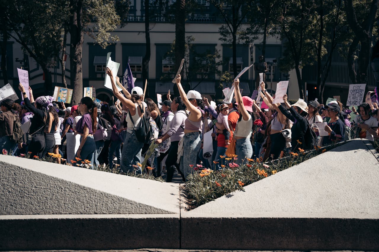 Crowd in a peaceful demonstration in Mexico City, highlighting social activism and unity in urban setting.
